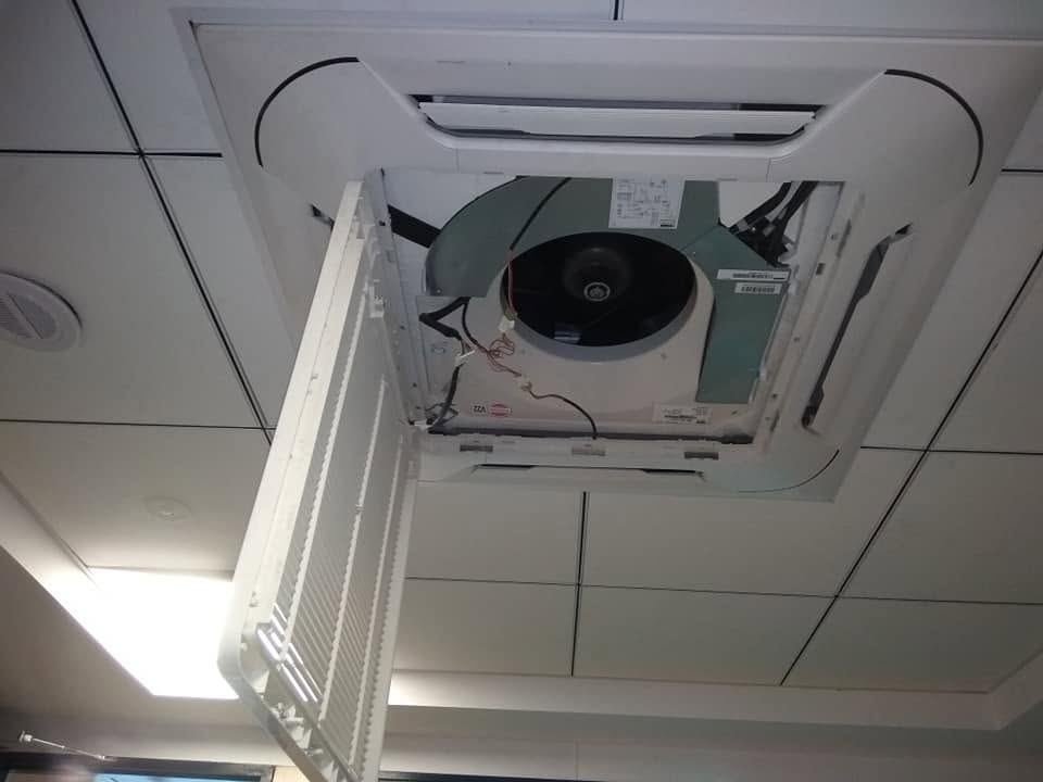 Cassette AC panel opened for servicing