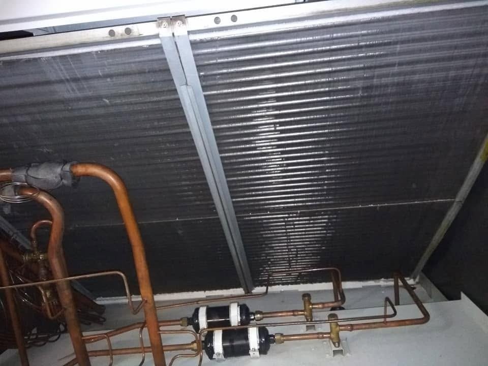 Package AC condenser coil after servicing